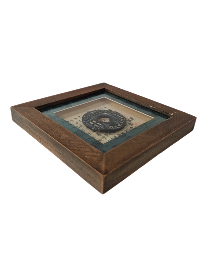 Kiinalainen kolikko kehystettynä