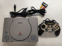 Playstation 1  -konsoli tarvikeohjaimella