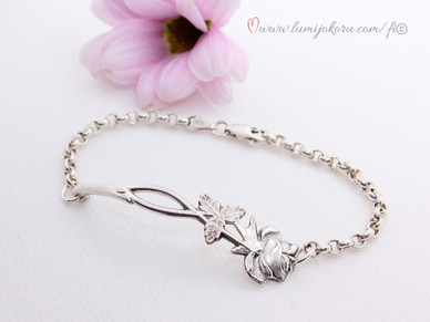 Rannekoru ruusulusikasta hopeaa