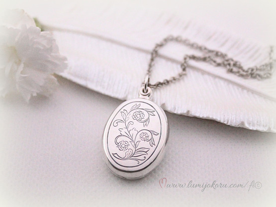 Medaljonki Lapista Kalevala koru hopeaa