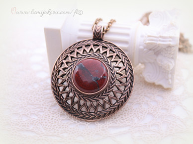 Kalevala koru Uskelan riipus pronssi