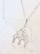 Valokoru riipus hopeaa