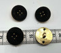 Kultamusta kantanappi 23mm