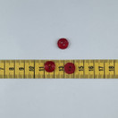 Punainen kiiltävä nappi