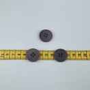 Harmaa violetti nappi