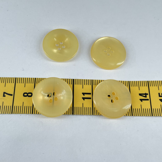 Kiiltävä keltainen nappi