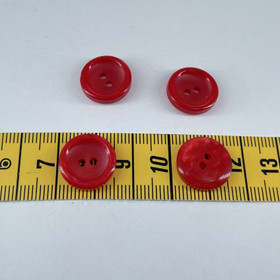 Kiiltävä punainen nappi