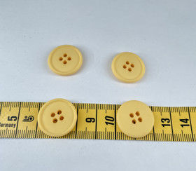 Keltainen muovinappi 20mm