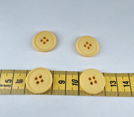 Keltainen muovinappi 20mm